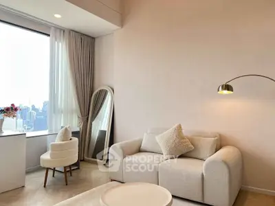 Elegant living room with city view, cozy sofa, and modern decor in a high-rise apartment.