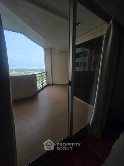 Spacious balcony with panoramic city view from modern apartment