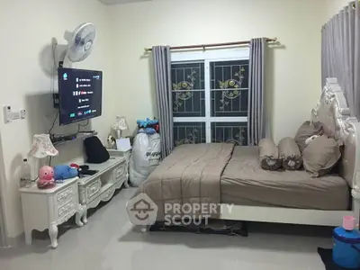 Charming bedroom with elegant decor and modern amenities, perfect for relaxation and comfort.