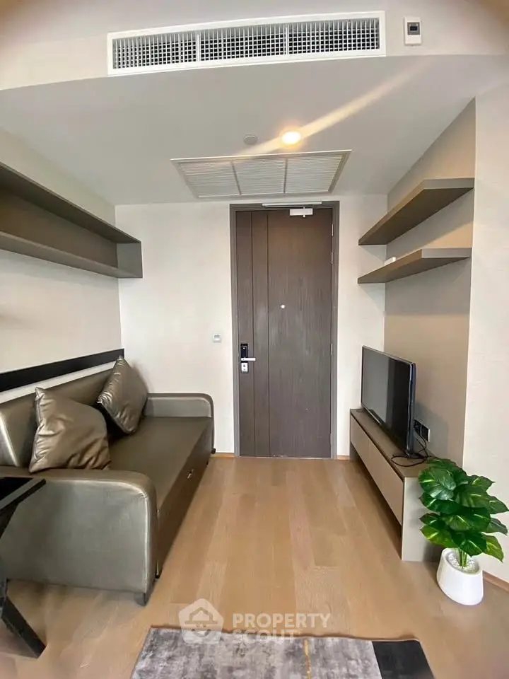 Modern living room with sleek furniture and wooden flooring