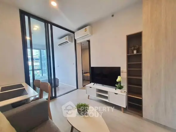Modern living room with sleek furniture and air conditioning in a stylish apartment.