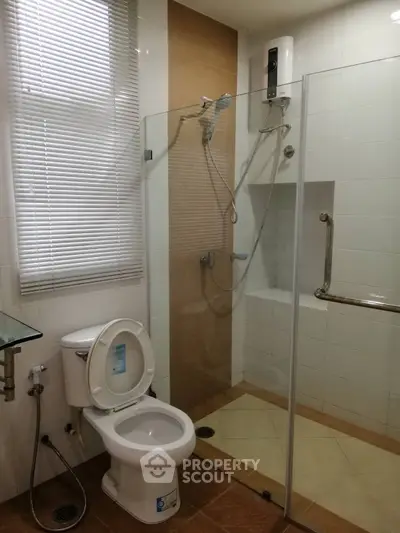 Modern bathroom with glass shower and sleek fixtures