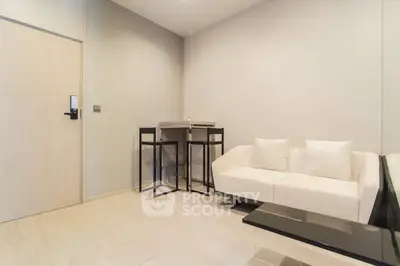 Modern living room with minimalist decor and cozy seating area