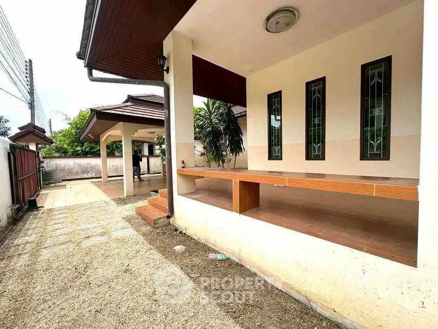 Charming single-story home with spacious outdoor area and covered patio.