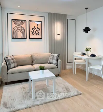 Modern living room with stylish decor, cozy sofa, and elegant dining area in a chic apartment.