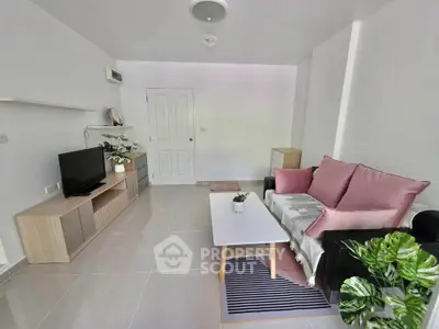 Modern living room with sleek furniture and stylish decor in a bright apartment.