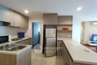 Modern kitchen with sleek cabinetry and stainless steel appliances in a spacious open layout.