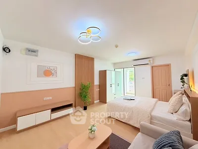 Spacious modern bedroom with stylish decor and natural light