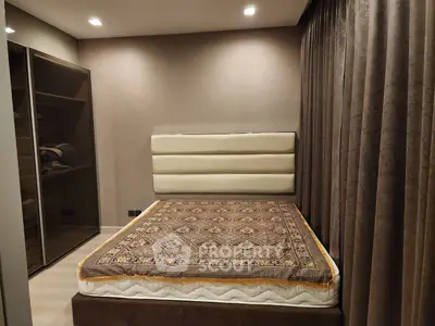 Cozy bedroom with elegant decor and spacious wardrobe, perfect for relaxation and comfort.