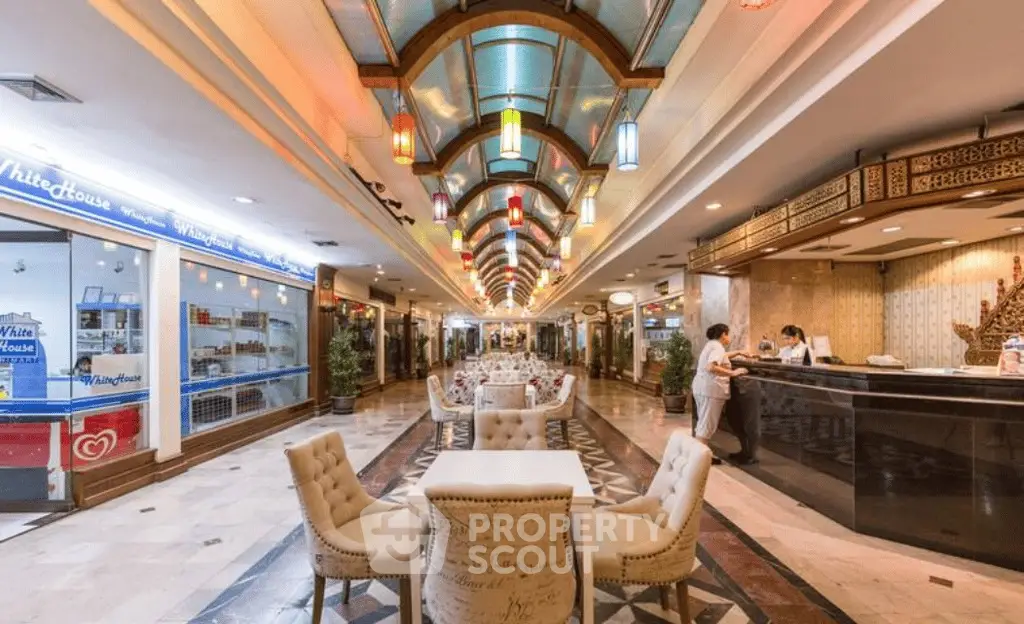 Luxurious shopping mall interior with elegant seating and vibrant lighting, perfect for upscale retail experiences.