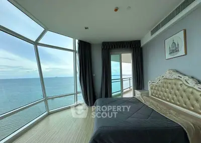 Luxurious bedroom with stunning ocean view and elegant decor in high-rise apartment