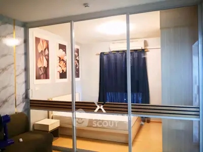 Modern bedroom with glass sliding doors and elegant decor