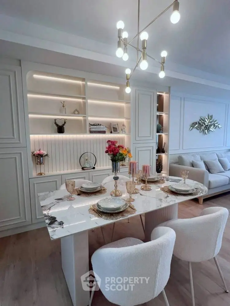 Elegant dining area with modern decor and stylish lighting in a luxurious apartment.