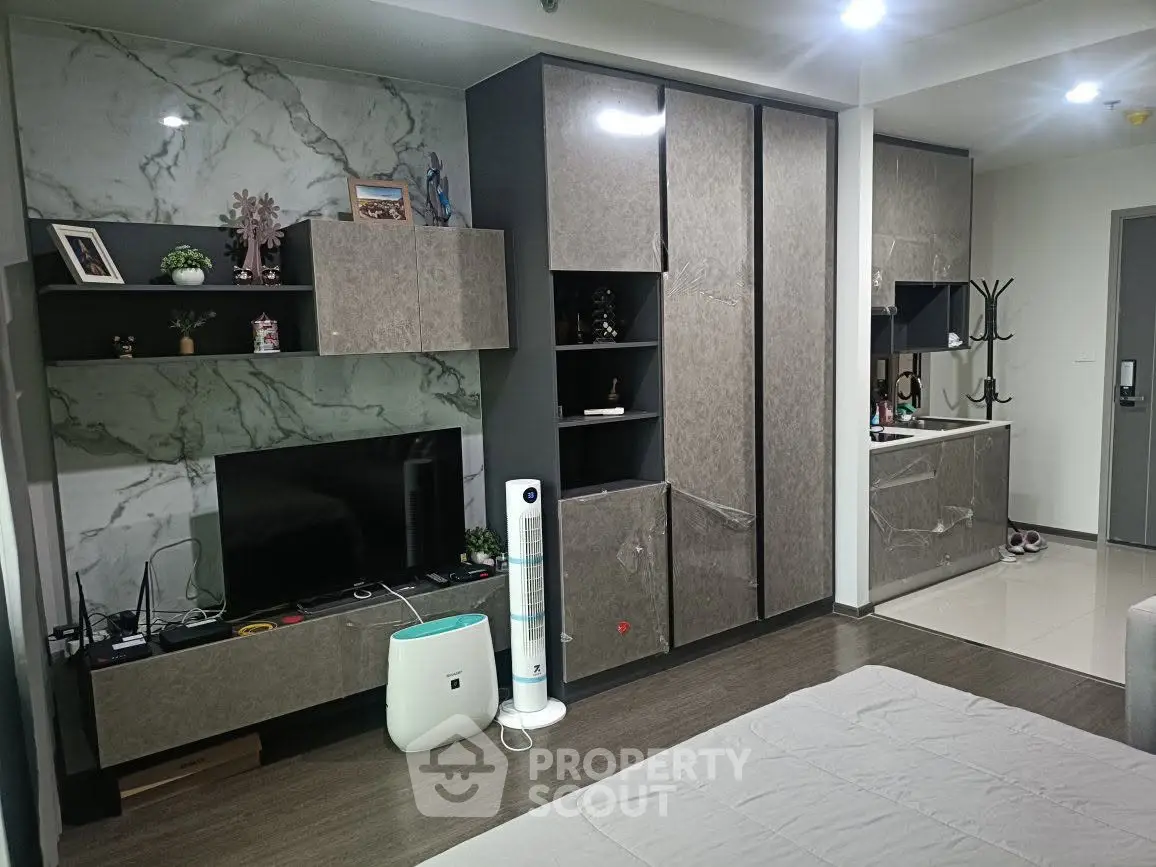 Modern living room with sleek storage cabinets and stylish decor