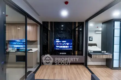 Modern open layout living room with sleek design and integrated kitchen and bedroom spaces