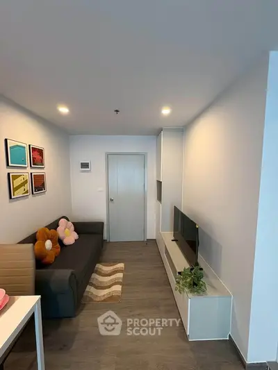 Modern living room with sleek furniture and stylish decor in a cozy apartment.