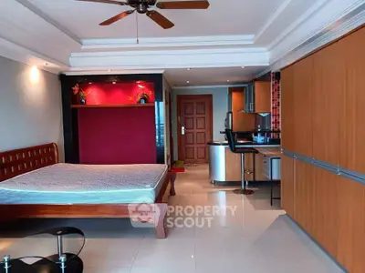 Spacious studio apartment with modern kitchen and stylish decor