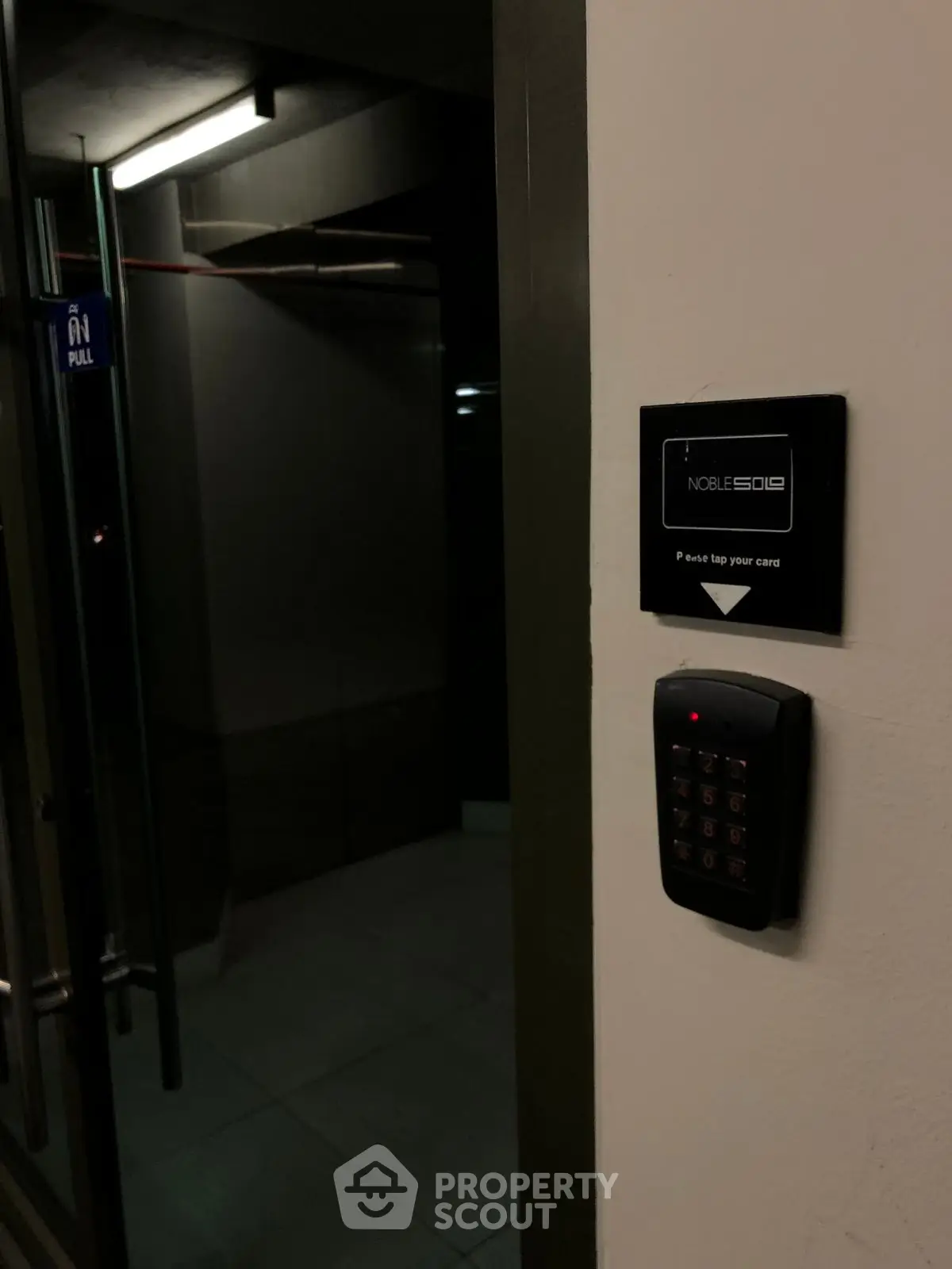 Secure building entrance with keycard access system for modern urban living.