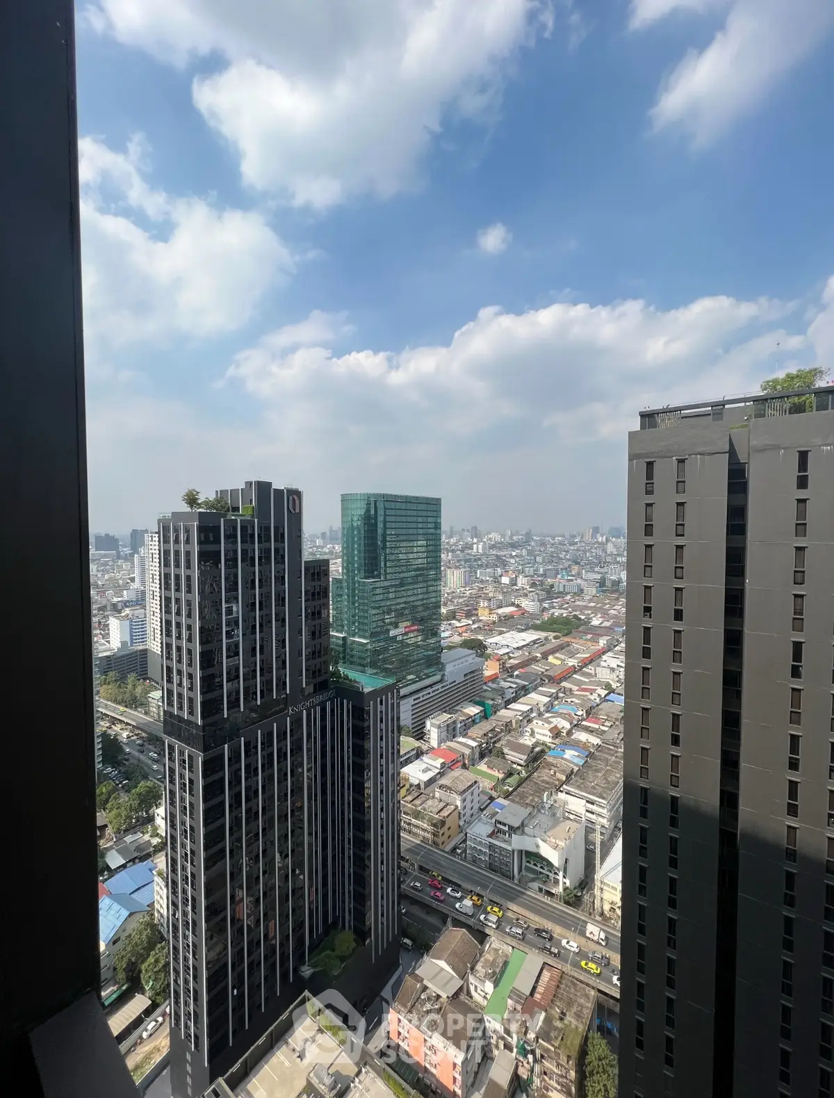 Stunning cityscape view from high-rise building with clear blue sky