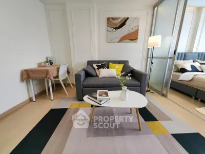Modern living room with stylish decor and cozy ambiance, featuring a comfortable sofa and elegant coffee table.