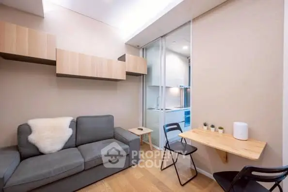 Modern compact living room with cozy sofa and stylish decor