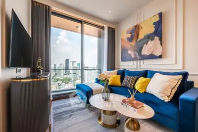 Luxurious living room with modern decor and stunning city view from balcony.