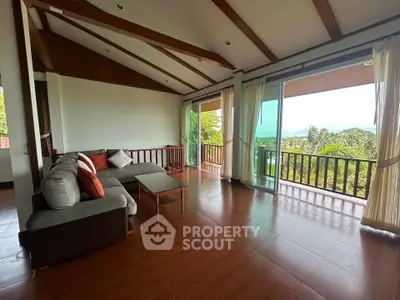 Spacious living room with panoramic views and wooden accents