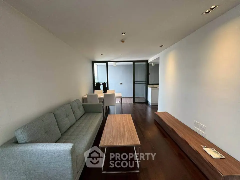 Modern living room with sleek furniture and open layout in a contemporary apartment.
