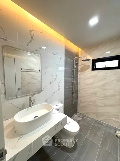 Modern bathroom with elegant marble tiles and sleek fixtures