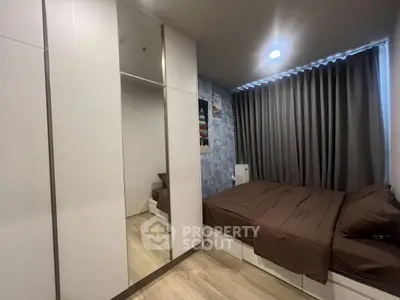 Modern bedroom with stylish decor and ample storage space