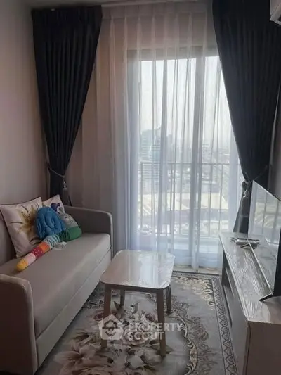 Cozy living room with modern decor and balcony view