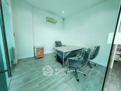 Modern office space with sleek furniture and air conditioning, perfect for productivity.