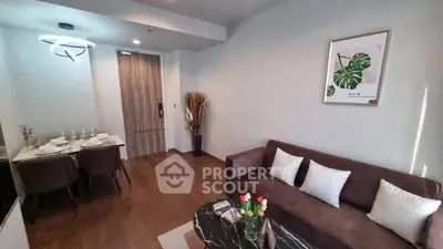 Modern living room with elegant dining area and stylish decor