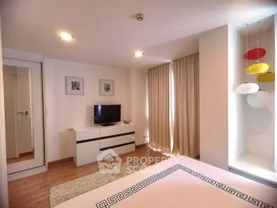 Modern bedroom with stylish decor and natural light