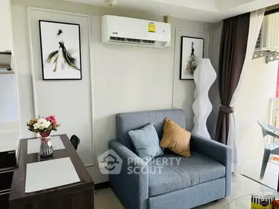Chic modern living room with stylish decor and cozy seating in a bright apartment.