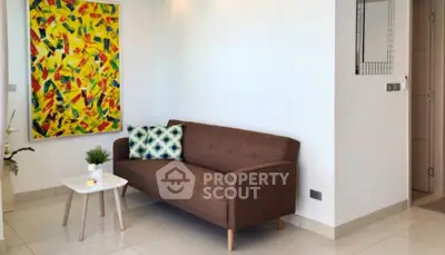 Modern living room with stylish sofa and vibrant artwork