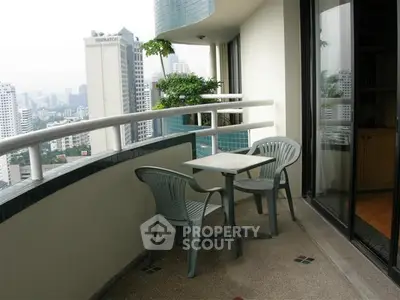Spacious balcony with city view, perfect for relaxing and enjoying the skyline.