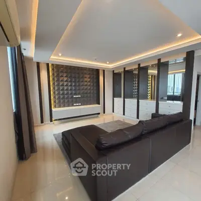 Luxurious modern living room with stylish leather sofa and elegant wall paneling