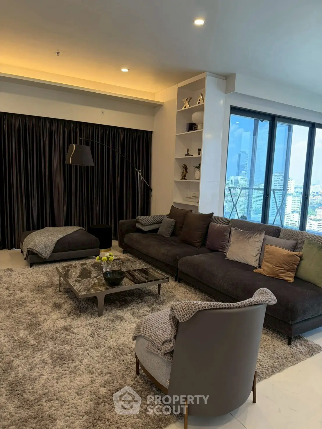 Luxurious living room with modern decor and stunning city view