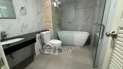 Modern bathroom with sleek design and freestanding bathtub