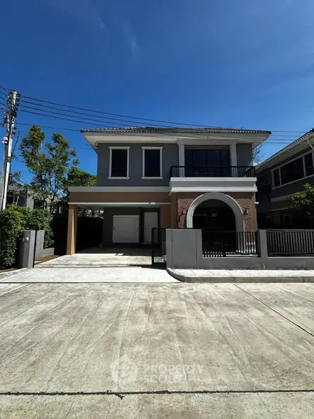 Stunning two-story house with modern design and spacious driveway in a serene neighborhood.