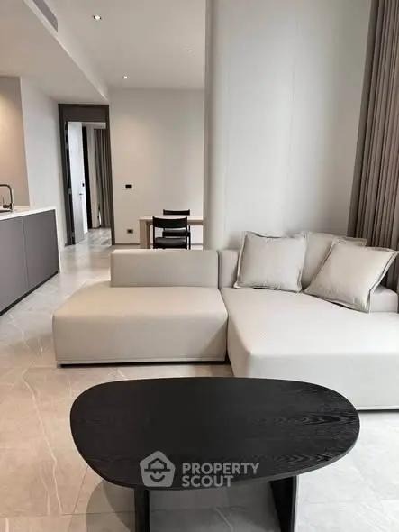 Modern living room with sleek furniture and open layout in a stylish apartment.