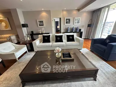 Luxurious living room with elegant furniture and large coffee table, perfect for entertaining.