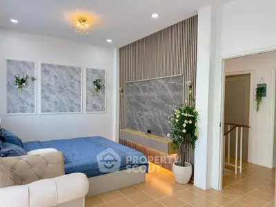 Elegant bedroom with modern decor, featuring a cozy bed, stylish wall art, and ambient lighting.
