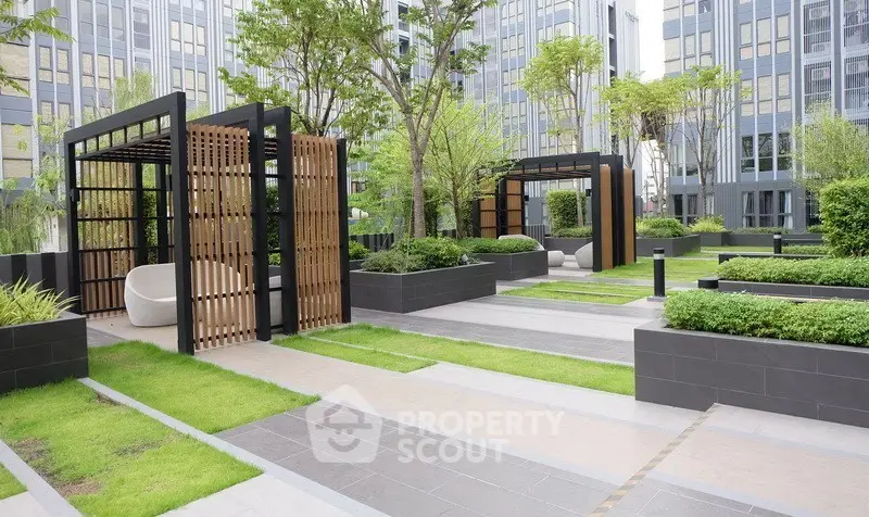Modern garden area with stylish pergolas and lush greenery in urban setting.