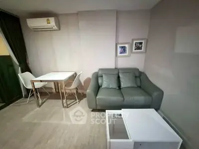 Cozy living room with modern furniture and air conditioning in a stylish apartment.