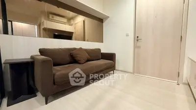 Modern living room with brown sofa and minimalist decor