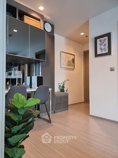 Modern study area with sleek furniture and stylish decor in a contemporary apartment.