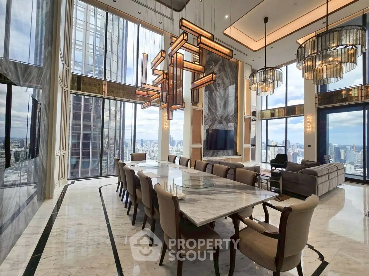 Luxurious high-rise living room with panoramic city views and elegant modern decor.