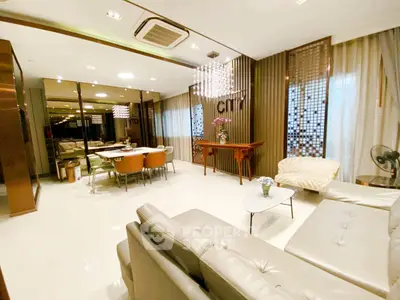 Luxurious living room with modern decor, elegant lighting, and spacious seating area.